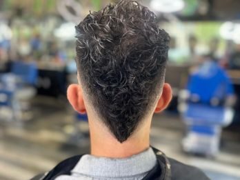 Curly taper fade back view barber Murrieta CA Payd 2 Fade